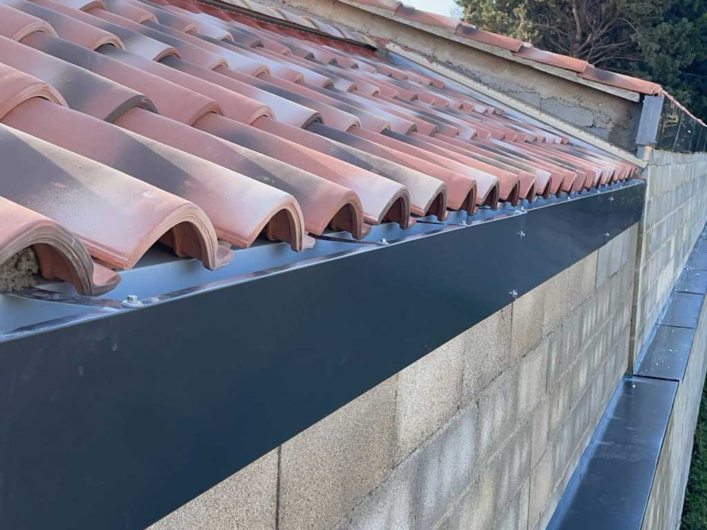 Pose gouttières zinc